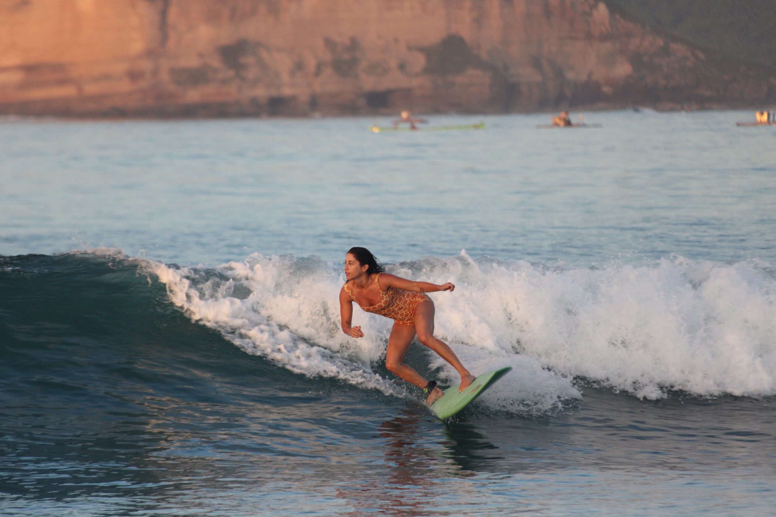 surfer catching a barrel wave during a surf trip in Lombok