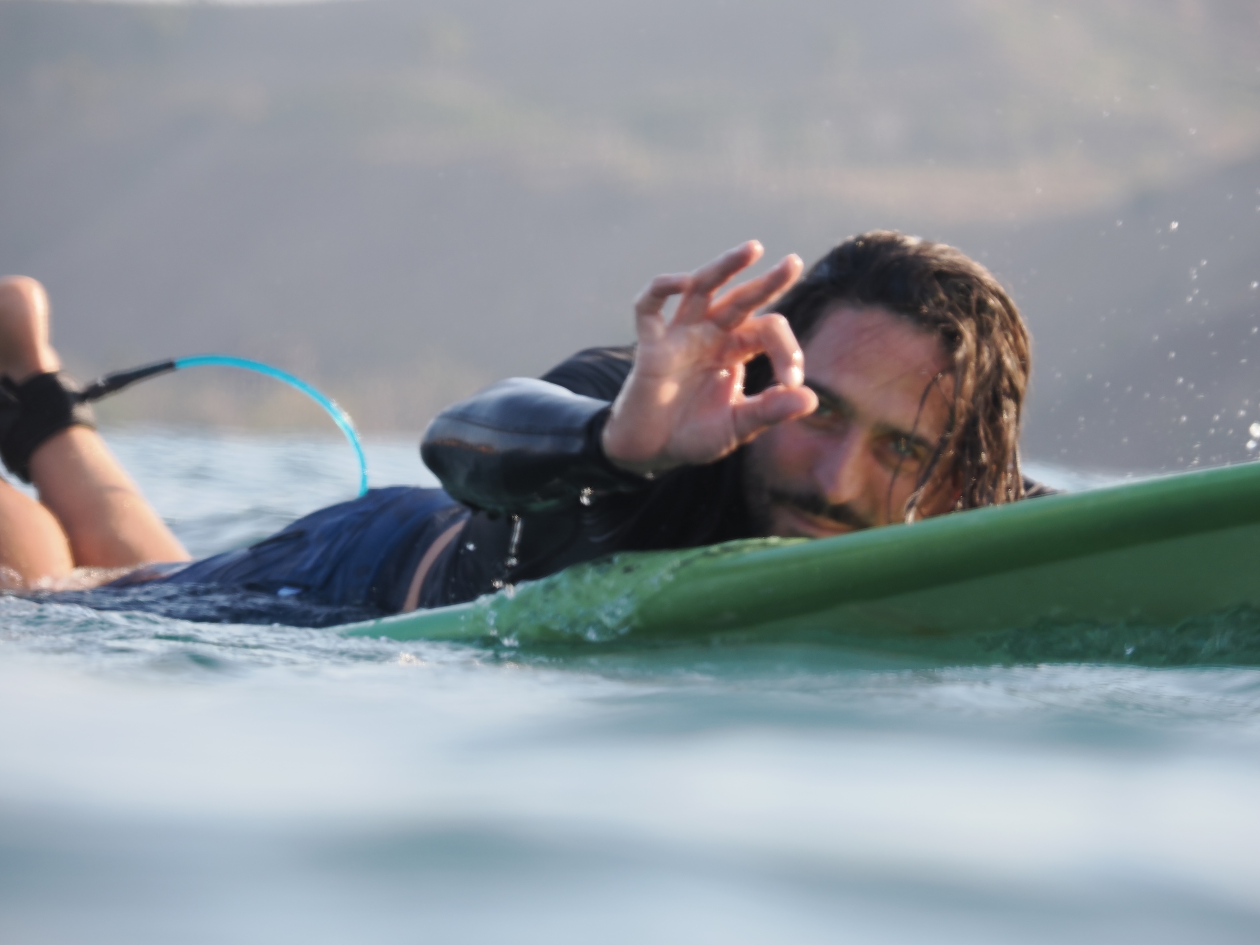• Surfing clean reef break waves in Gerupuk Bay near Roots Lombok retreat